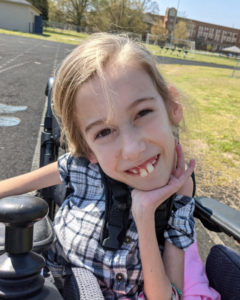 Callie Golden in wheelchair on a sunny day in April 2021